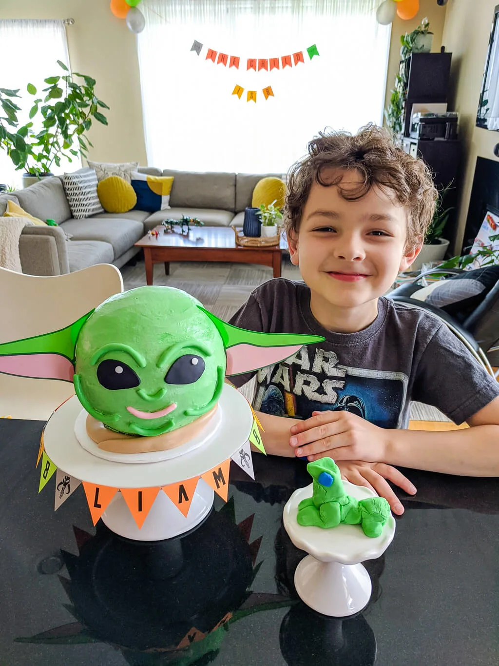 Liam with his Baby Yoda birthday cake. Copyright Merriment Design Co. Do not distribute without written permission.