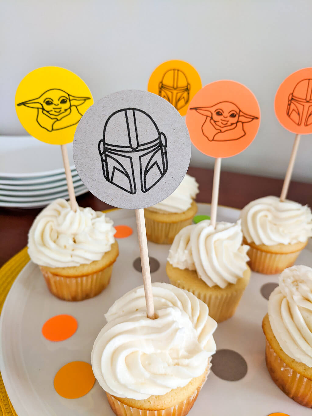 Mandalorian helmet cupcake topper on cupcakes