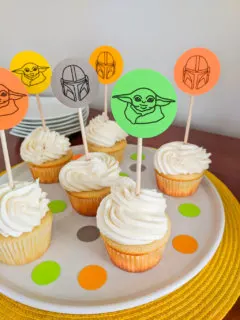 Mandalorian cupcakes with Baby Yoda The Child and Mandalorian helmet cupcake toppers