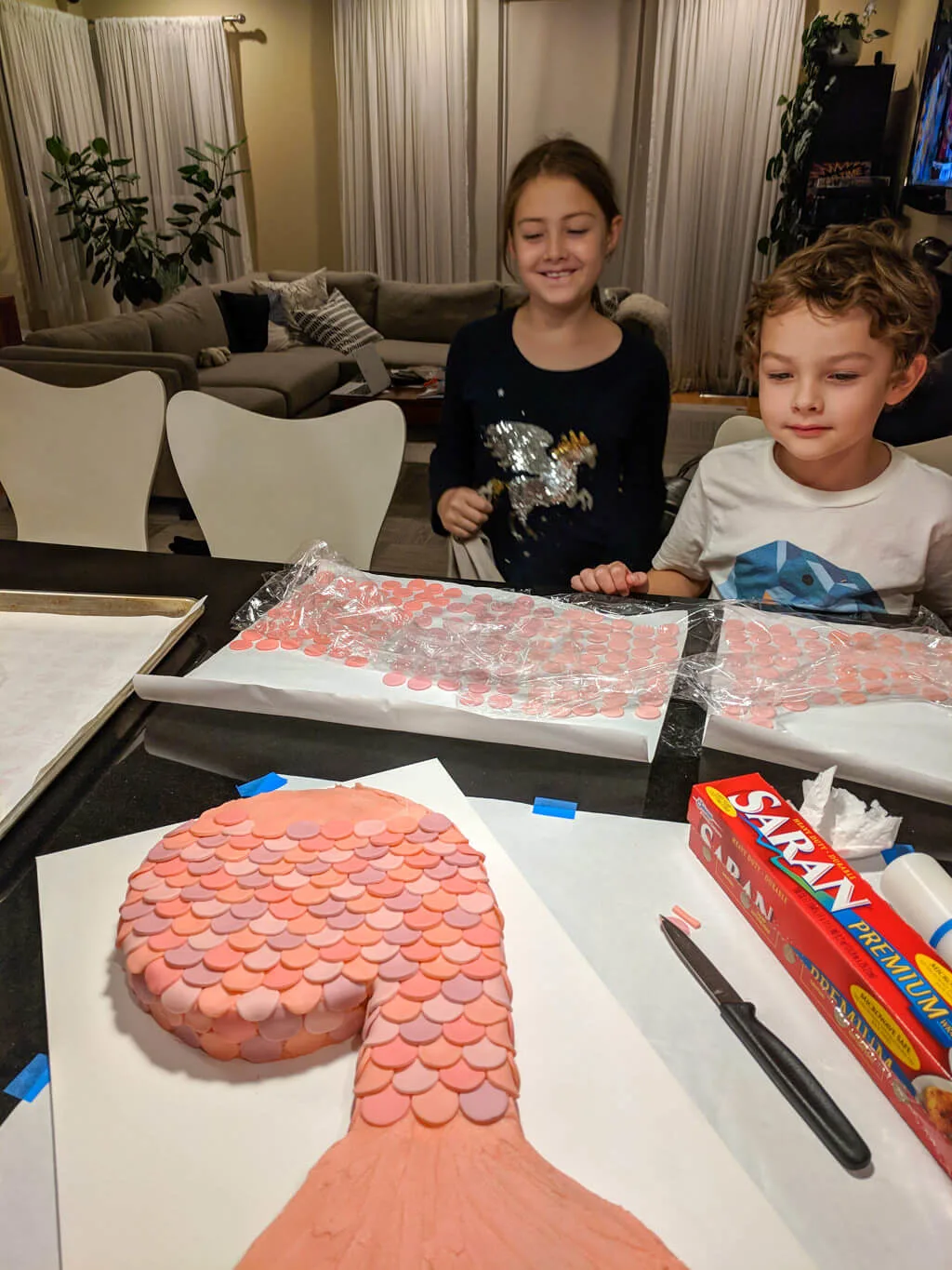 Kids looking at DIY mermaid cake