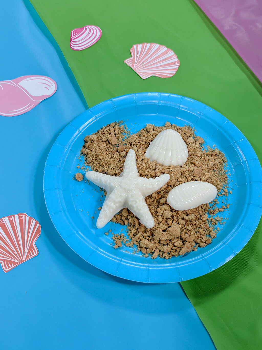 Chocolate shells with crushed graham cracker sand