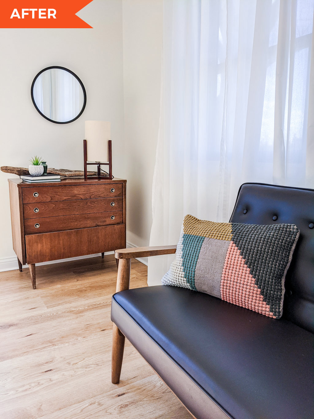 Mid-century modern geometric pillow, dresser, lamp, and round mirror