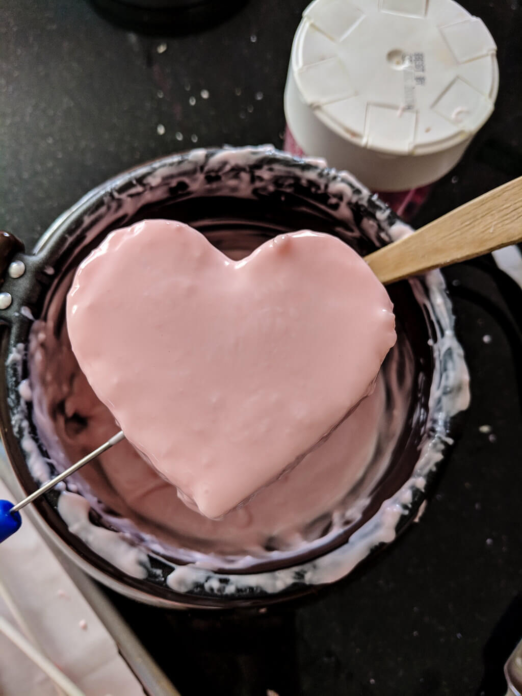 Heart cake coated in melted chocolate