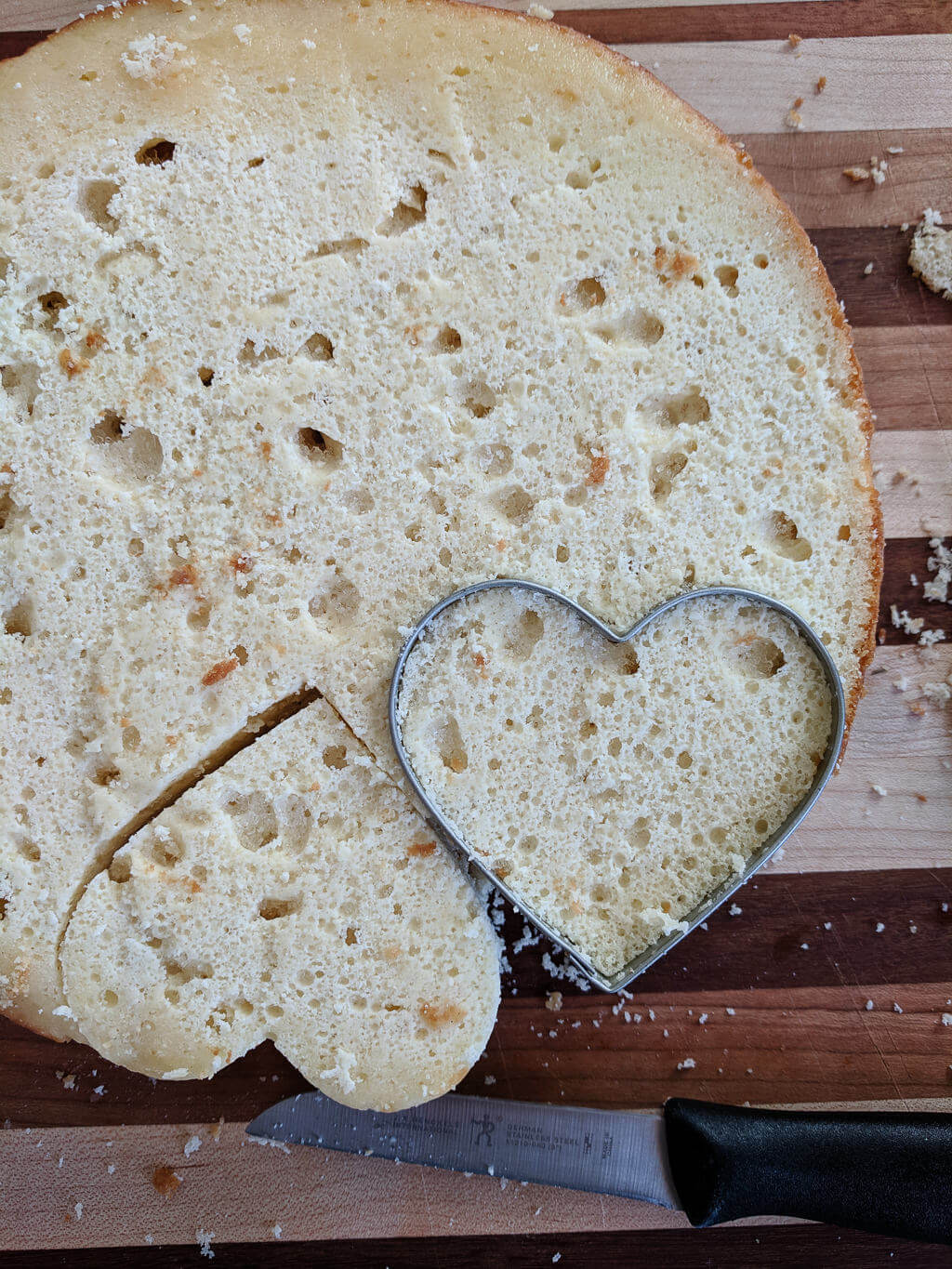 Cutting cake with heart cookie cutters