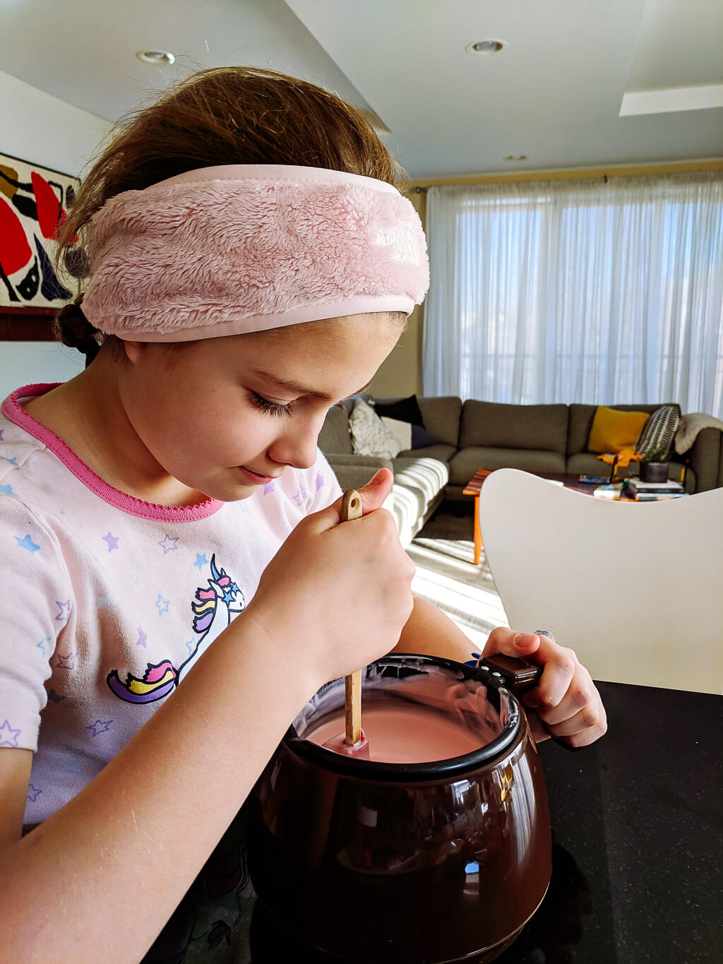 Elise stirring melted chocolate (copyright Kathy Beymer)