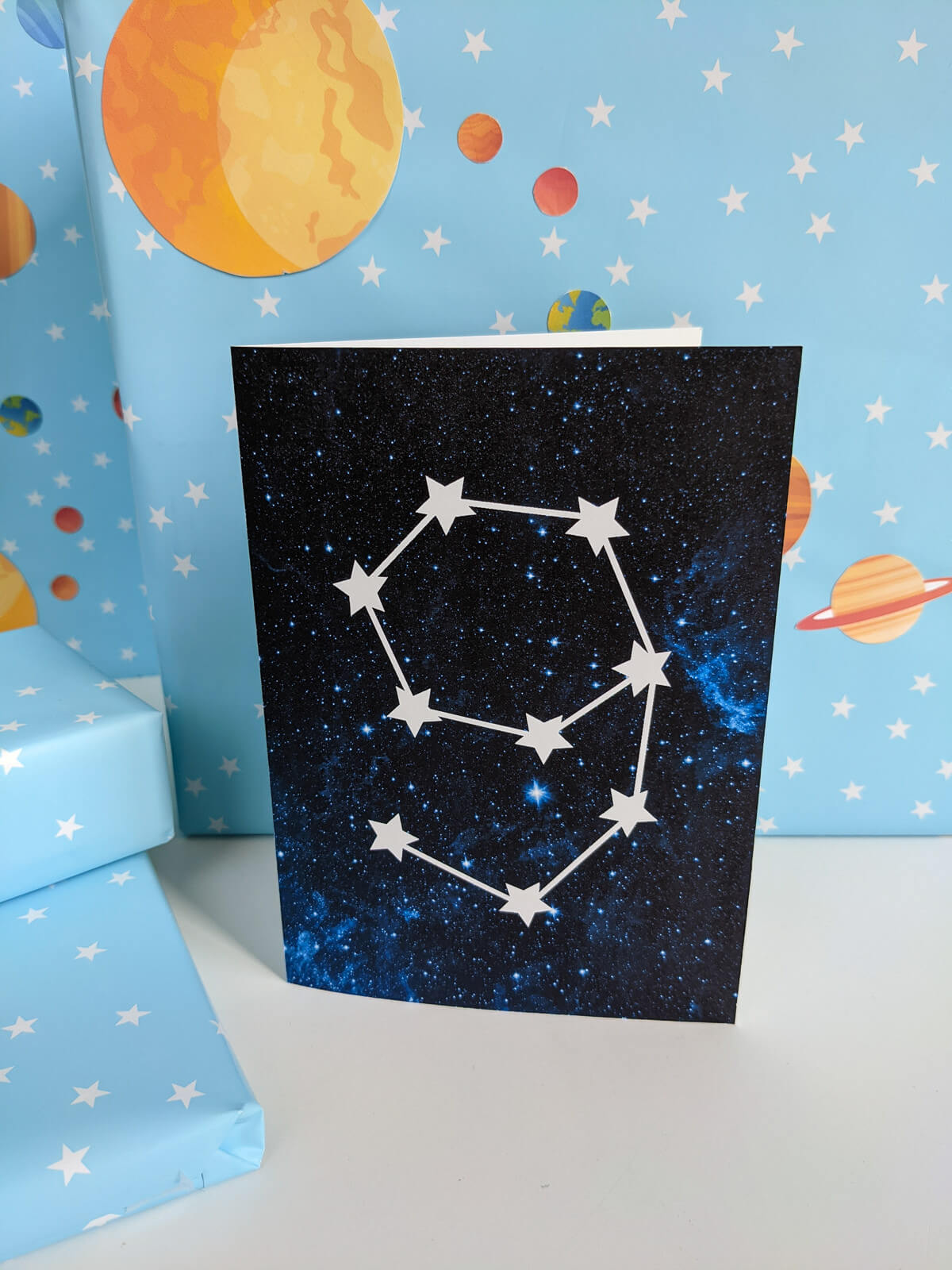 Outer space birthday card printable PDF with an age 9 star constellation on a blue galaxy background