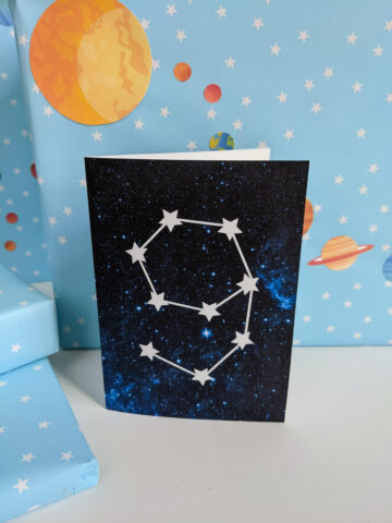 Outer space birthday card printable PDF with an age 9 star constellation on a blue galaxy background