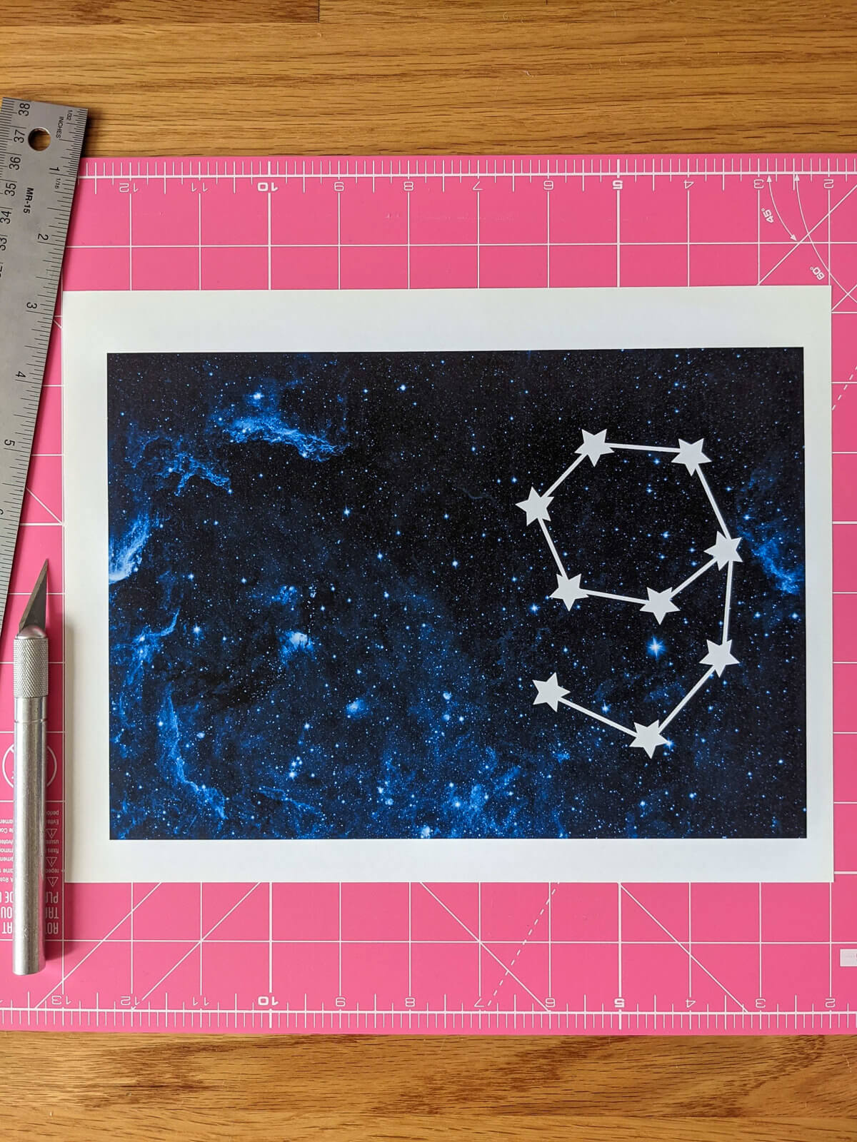 Printable outer space birthday card with galaxy and constellation age ready on a cutting mat