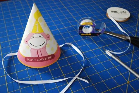 Pink monkey printable birthday party hat for kids free craft project tutorial by Kathy Beymer at Merriment Design