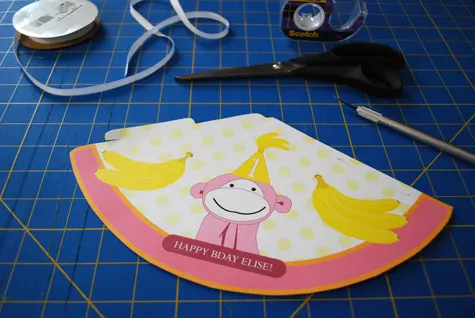 Pink monkey printable birthday party hat for kids free craft project tutorial by Kathy Beymer at Merriment Design