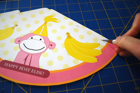 Pink monkey printable birthday party hat for kids free craft project tutorial by Kathy Beymer at Merriment Design