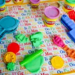 DIY kid's non-slip play mat for Play-Doh, coloring, painting, sand. Easy clean up and stays put! #sewing #freesewingpattern #sewingforkids #diyforkids #diygifts