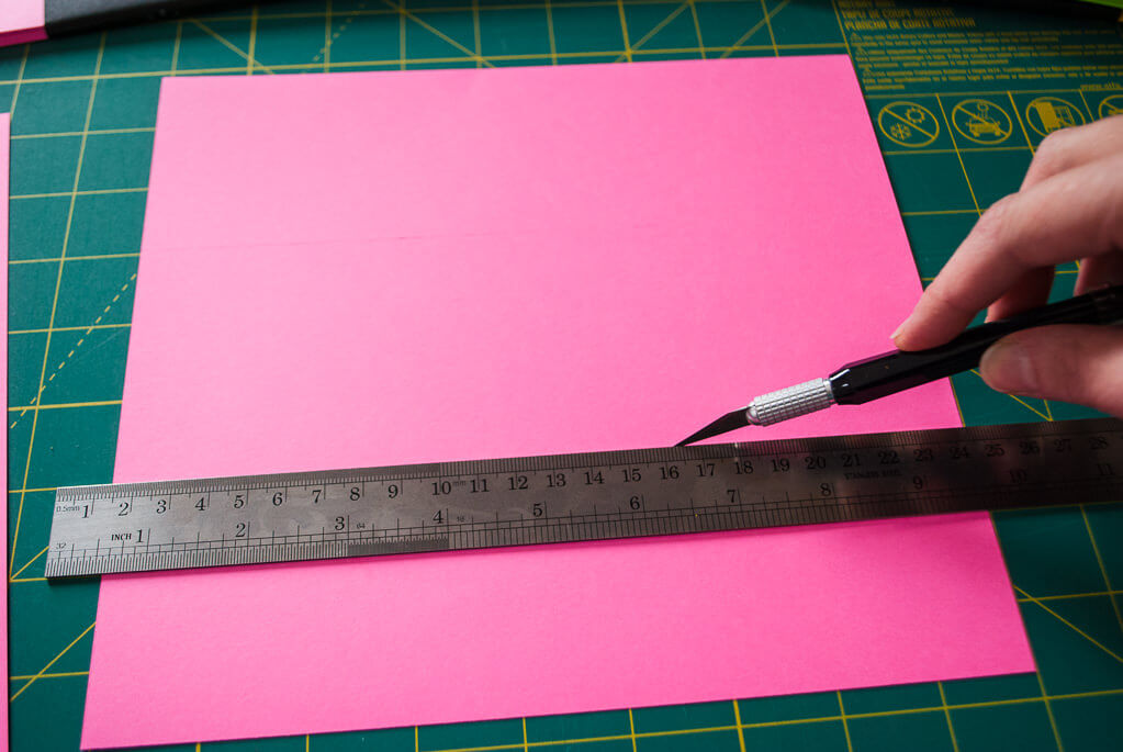 Scoring a piece of paper to make paper Easter baskets