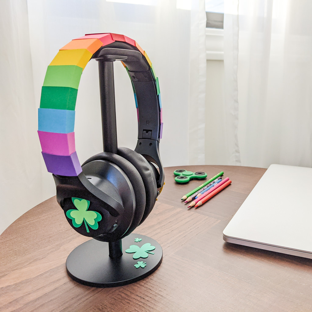 Headphones decorated with paper rainbows and pot of gold