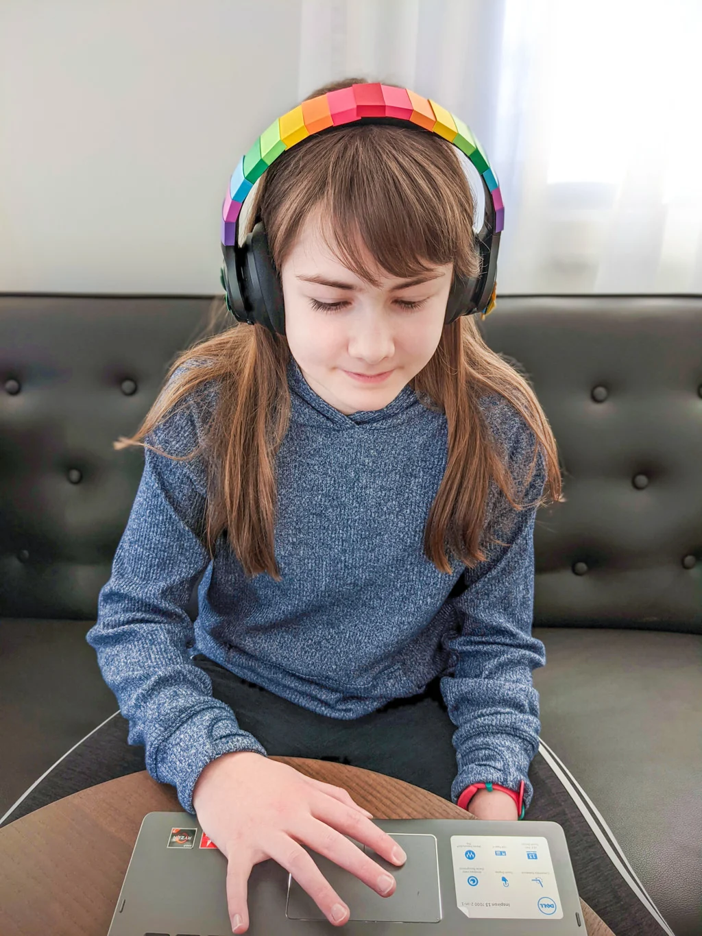 Elise wearing rainbow headphones. Copyright Merriment Design Co. Do not use without written permission.