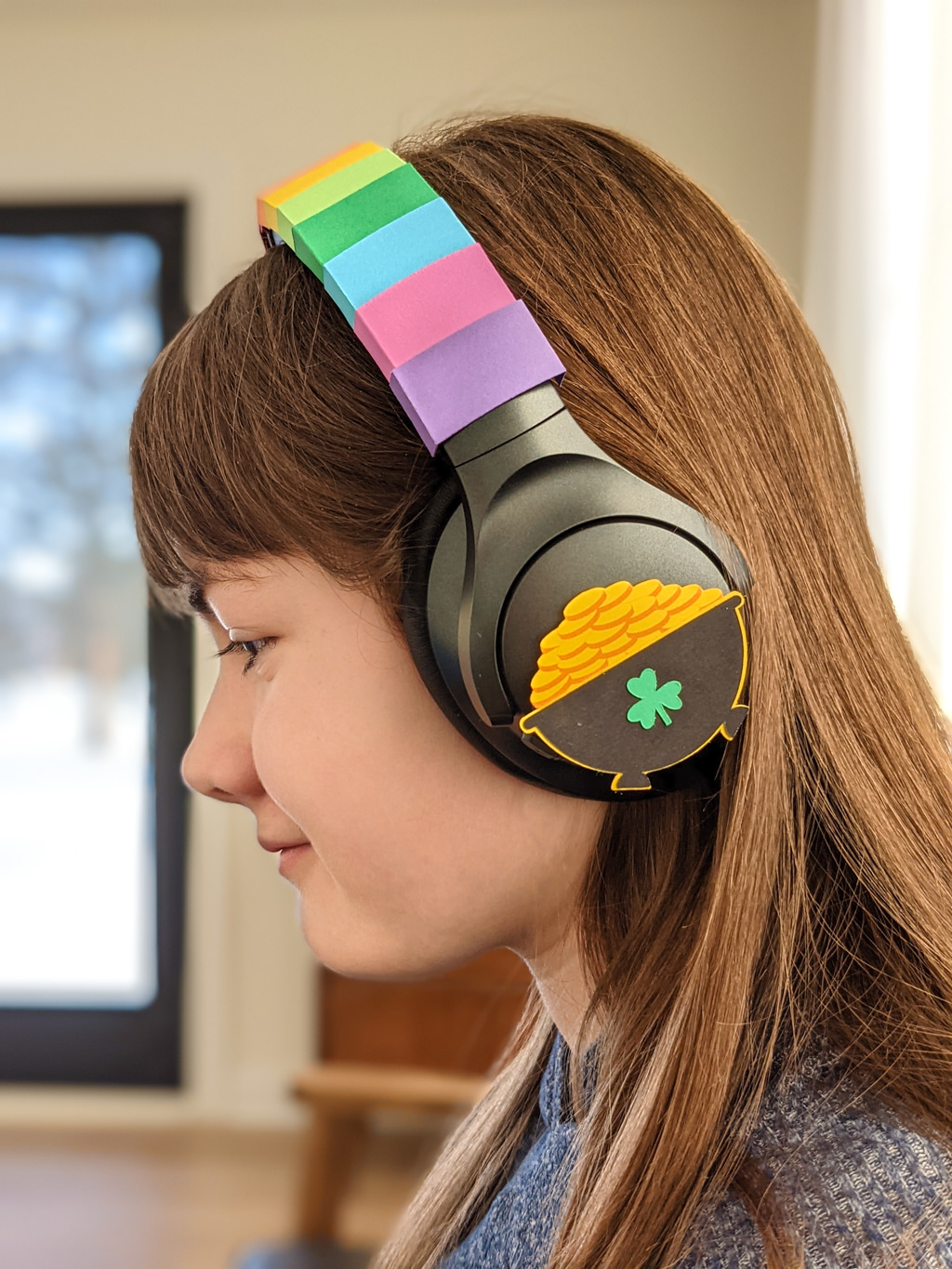 Elise wearing DIY rainbow headphones for St. Patrick's Day