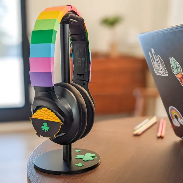 Headphones decorated with paper rainbows and pot of gold