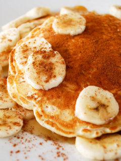 Rice pancakes on a plate with bananas and cinnamon