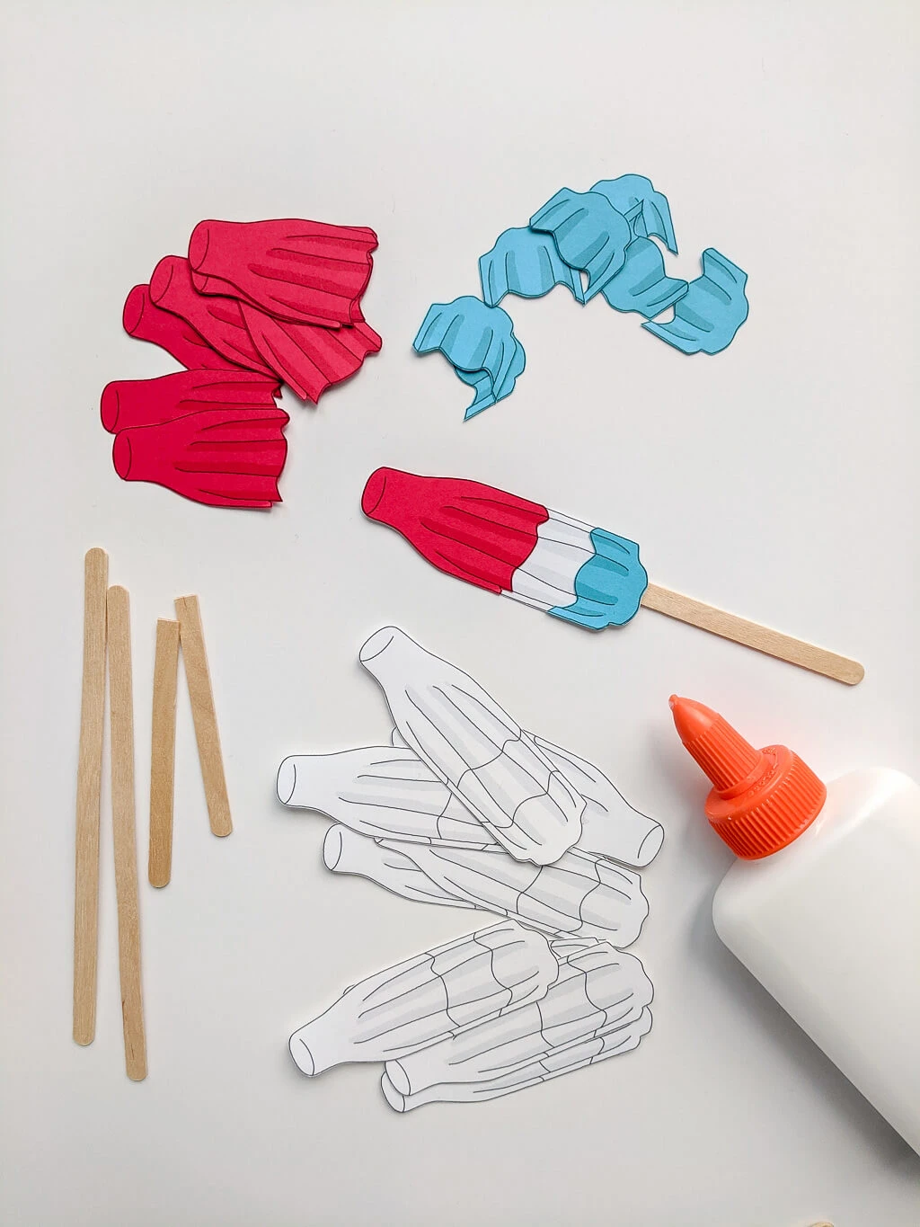 Making DIY Rocket Pops paper Fourth of July cupcake toppers