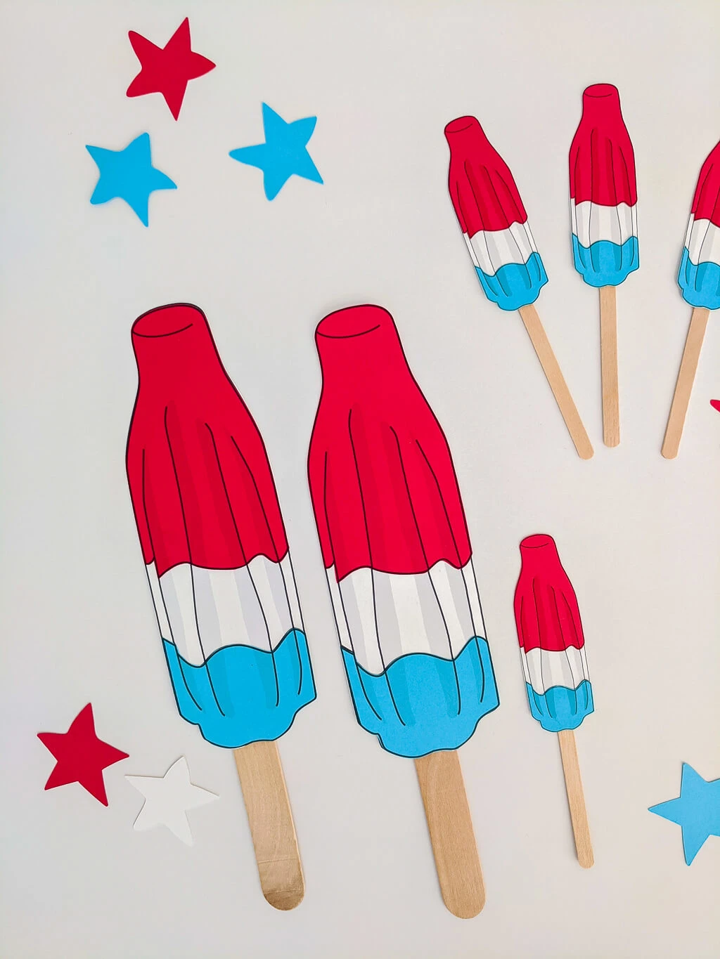 Paper Rocket Pops party decorations for cupcakes and garland