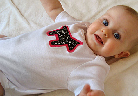 Baby with applique onesie