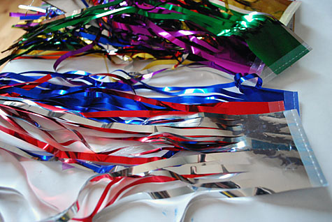 Merriment :: Sparkless Sparklers for kids for the Fourth of July using chopsticks, ribbon and party garland free craft by Kathy Beymer at MerrimentDesign.com