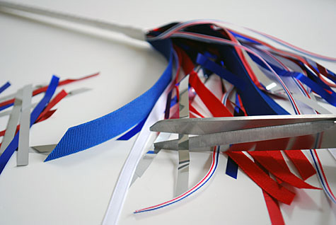 Merriment :: Sparkless Sparklers for kids for the Fourth of July using chopsticks, ribbon and party garland free craft by Kathy Beymer at MerrimentDesign.com