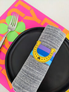 St. Patrick's Day paper napkin rings and placemats with horseshoes, rainbows, and shamrocks