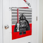 Make this easy and fun Star Wars DIY Birthday Party Game: Pin The Lightsaber On Darth Vader