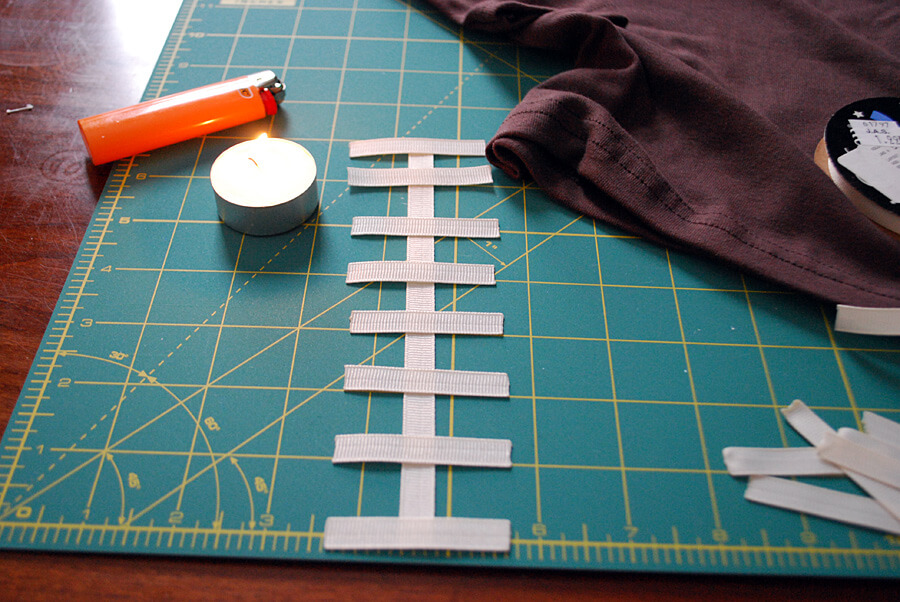 How to use a candle to keep grosgrain ribbon from raveling when making a DIY kids football t-shirt