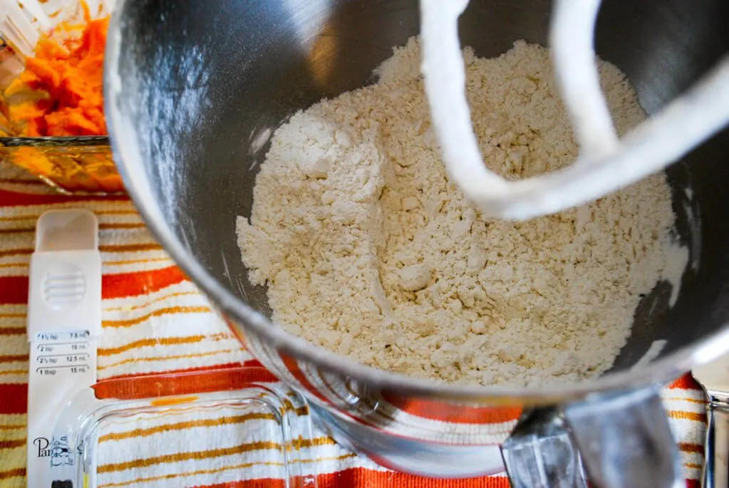Mixing flour and butter for sweet potato crackers
