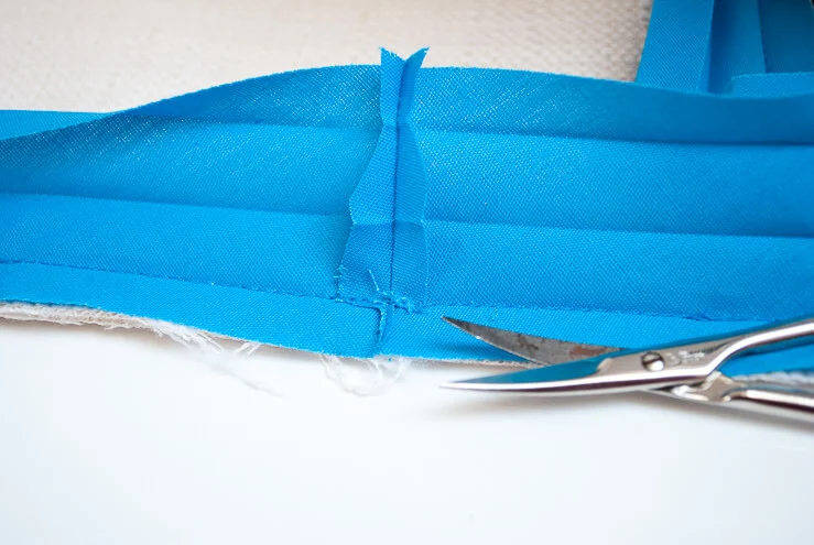 Trimming bias tape bulk from seams