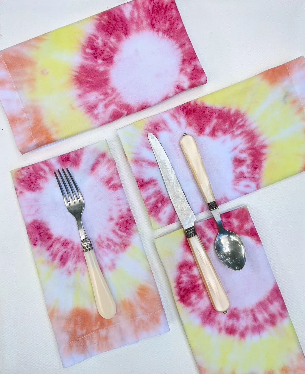 DIY tie-dye cloth napkins in yellow, red, and orange