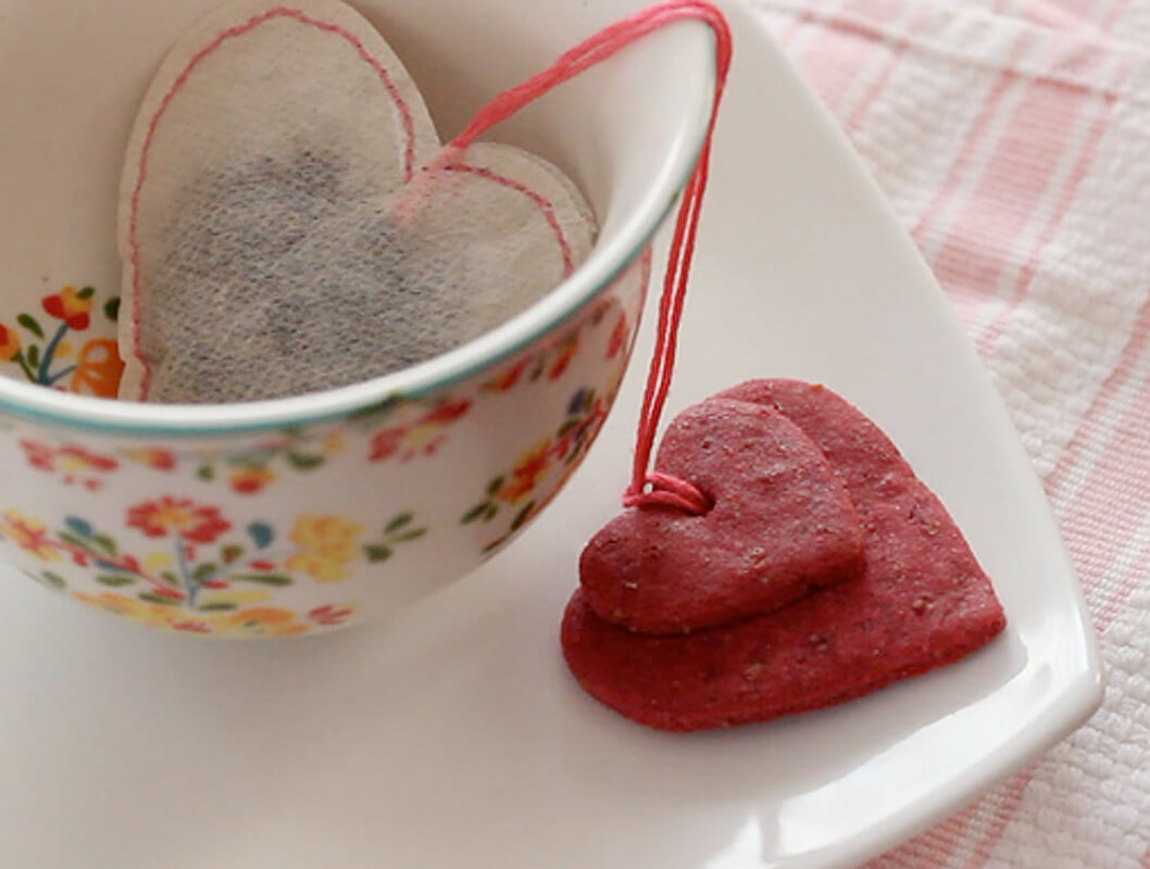 Plant based Valentine cookies tied to heart-shaped tea bags
