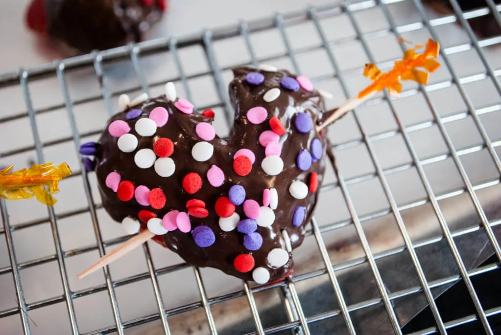 Chocolate strawberry hearts on wire baking rack