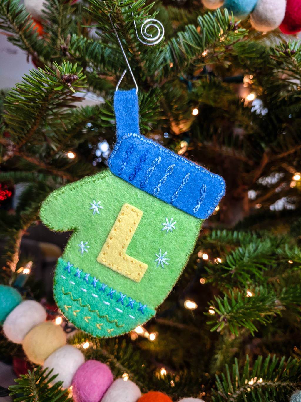 DIY felt mittens ornament on a Christmas tree