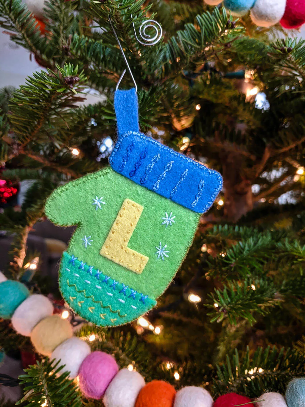 DIY felt mittens ornament on a Christmas tree